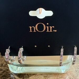 nOir Jewelry NWT Silver and Crystal Hoop Earrings, missing 1 pair.